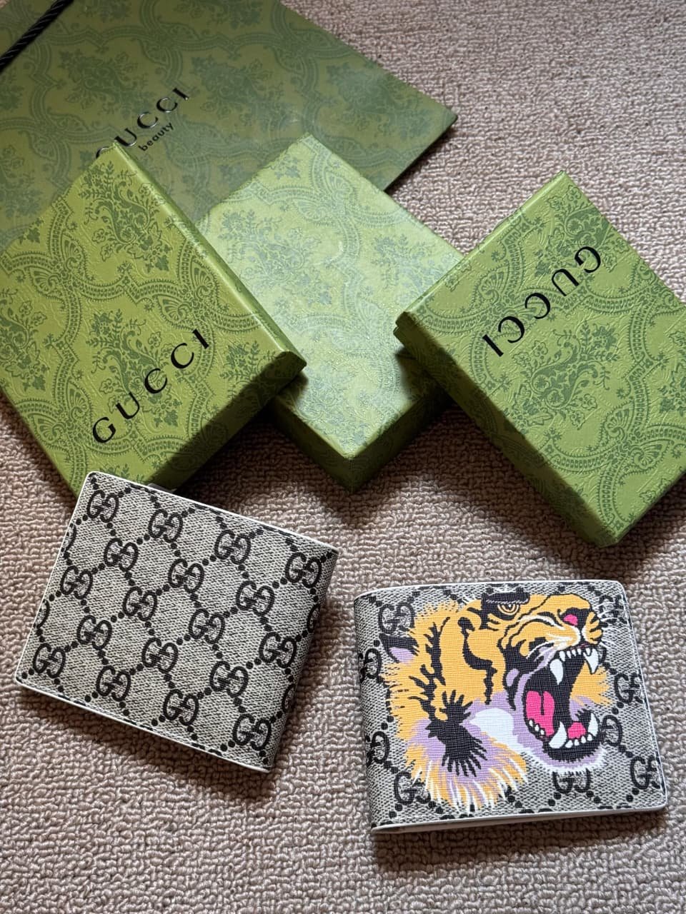 IMG-20260604-WA0209 Gucci GG Supreme Tiger Print Bifold Wallet (Beige/Ebony) - Image 1