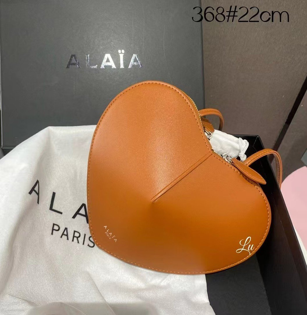 alaia-368-top-handle-bag-tan-orange-22-cm-1.jpg Alaïa 368 Top Handle Bag – Tan Orange, 22 cm - Image 1